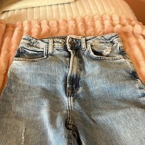 Flare pants with cut detail on the bottom